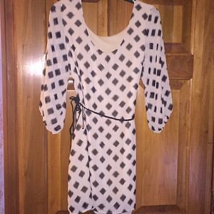 Very cute dress, hangs above the knee size small